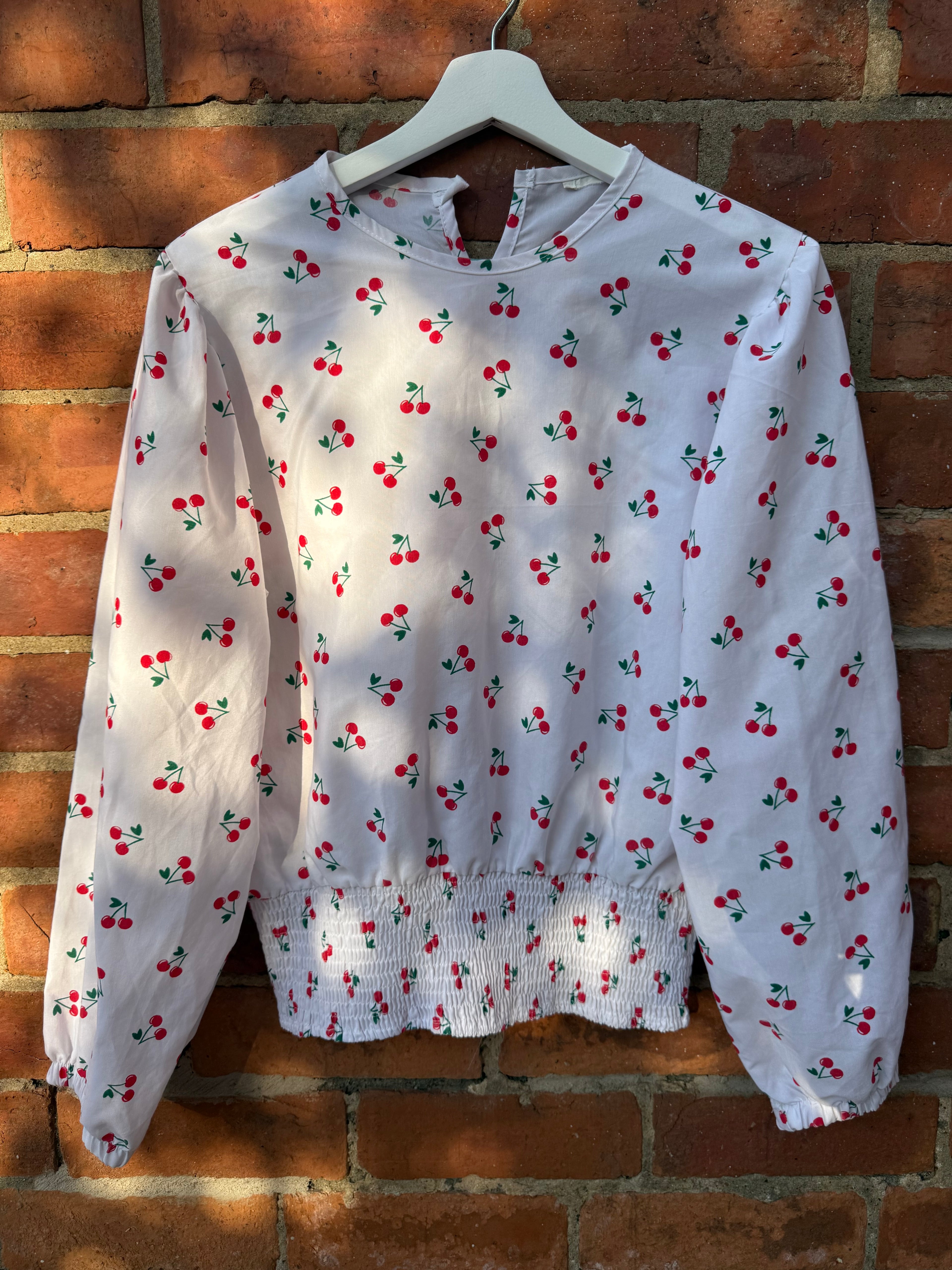 Women`s white balloon sleeve cherry print top