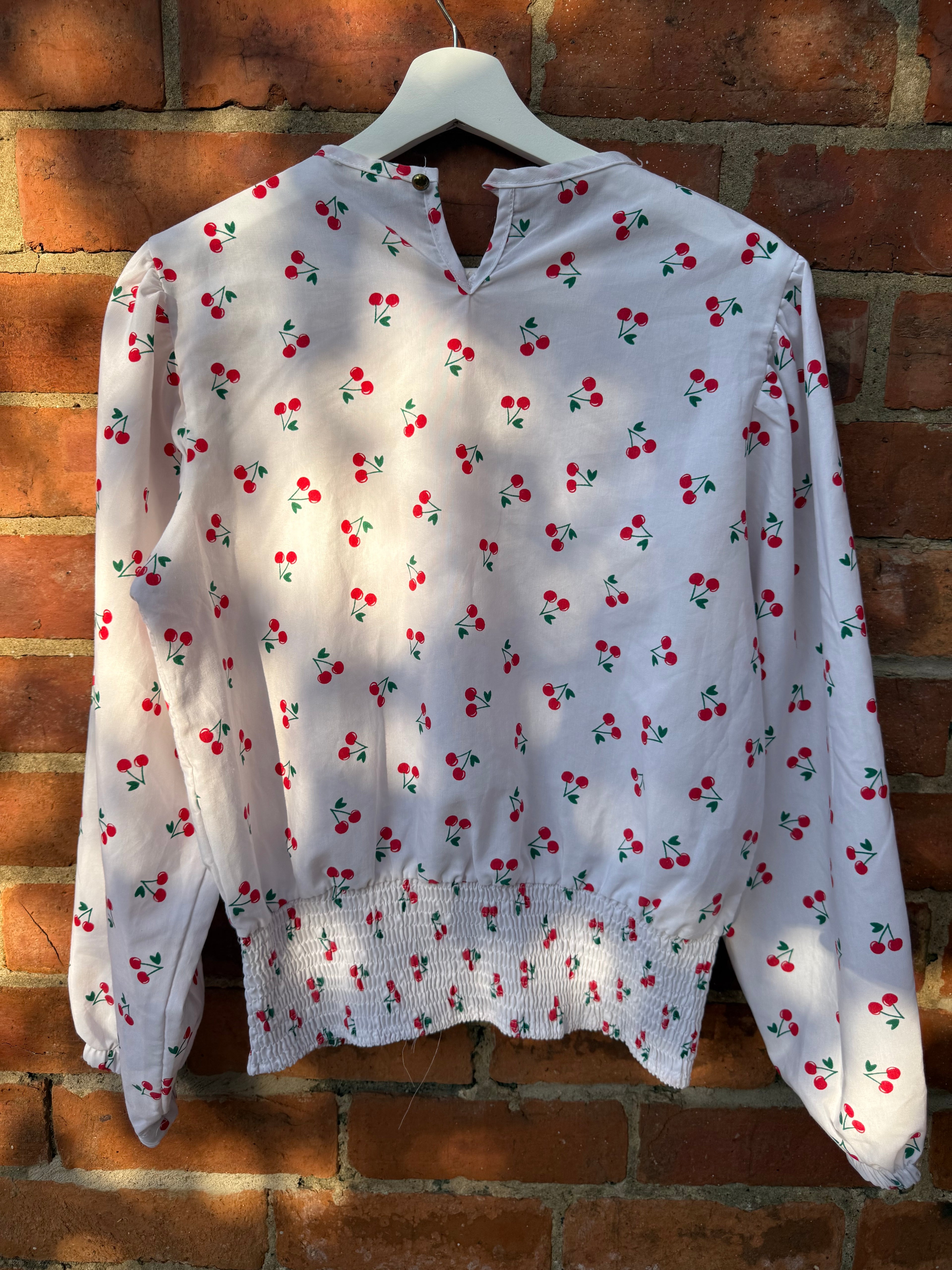 Women`s white balloon sleeve cherry print top